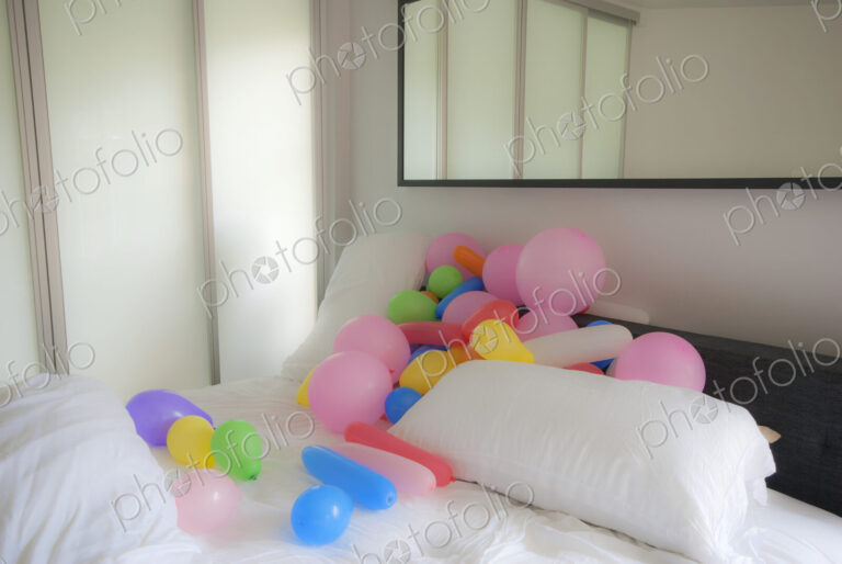 Balloons in a Messy Bed