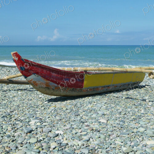 Banca Boat on a Stony Shore