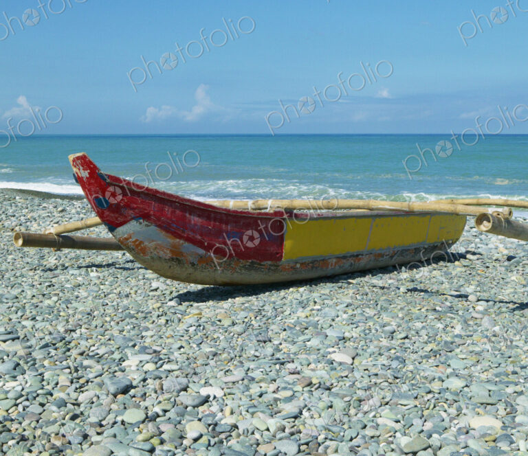 Banca Boat on a Stony Shore