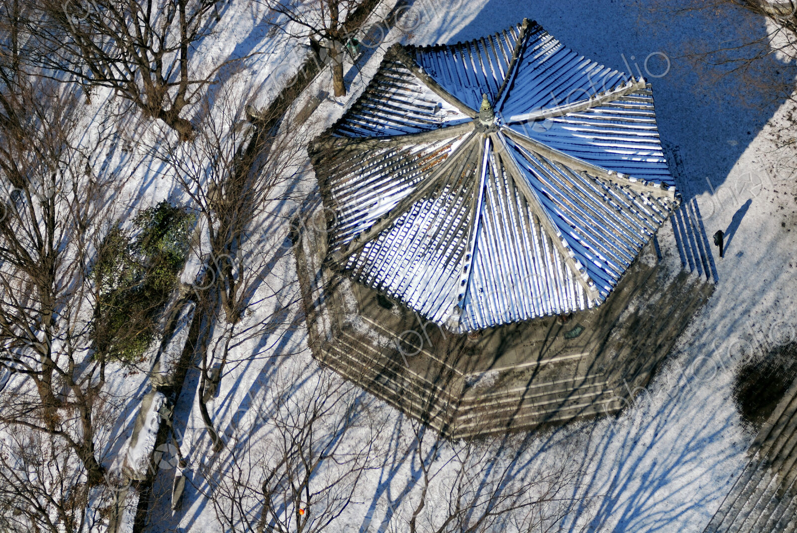 Bandstand in snowy park, from above.