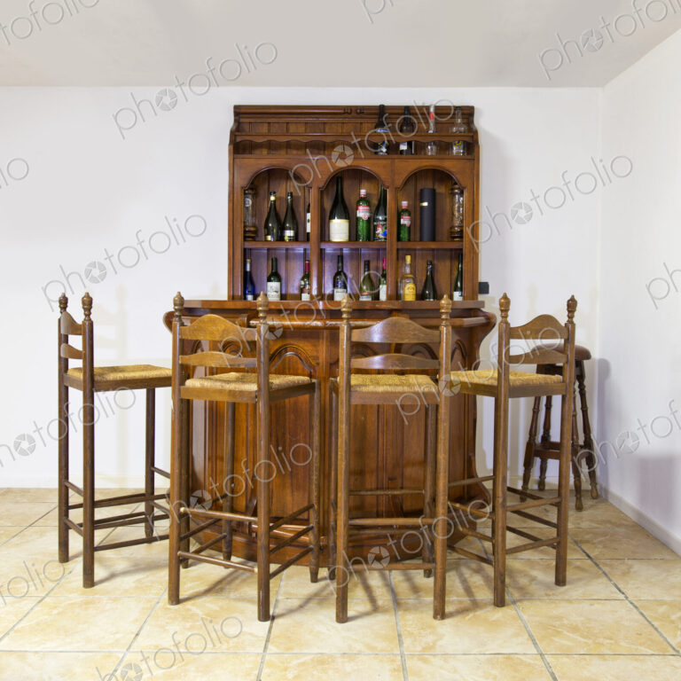 Bar and stools in basement
