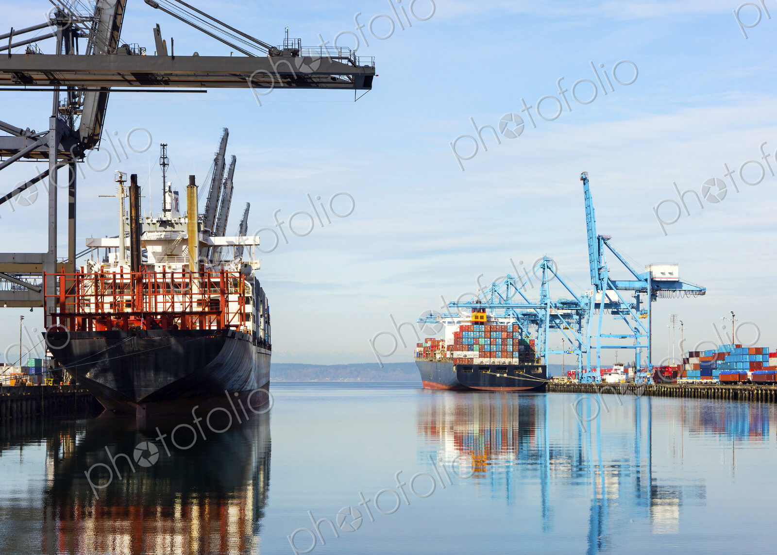Barges with containers in industrial shipyard