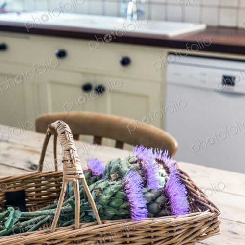 Basket of flowers in rustic domestic kitchen