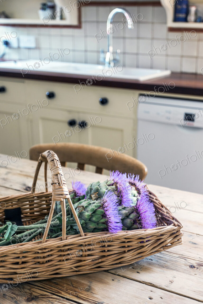 Basket of flowers in rustic domestic kitchen