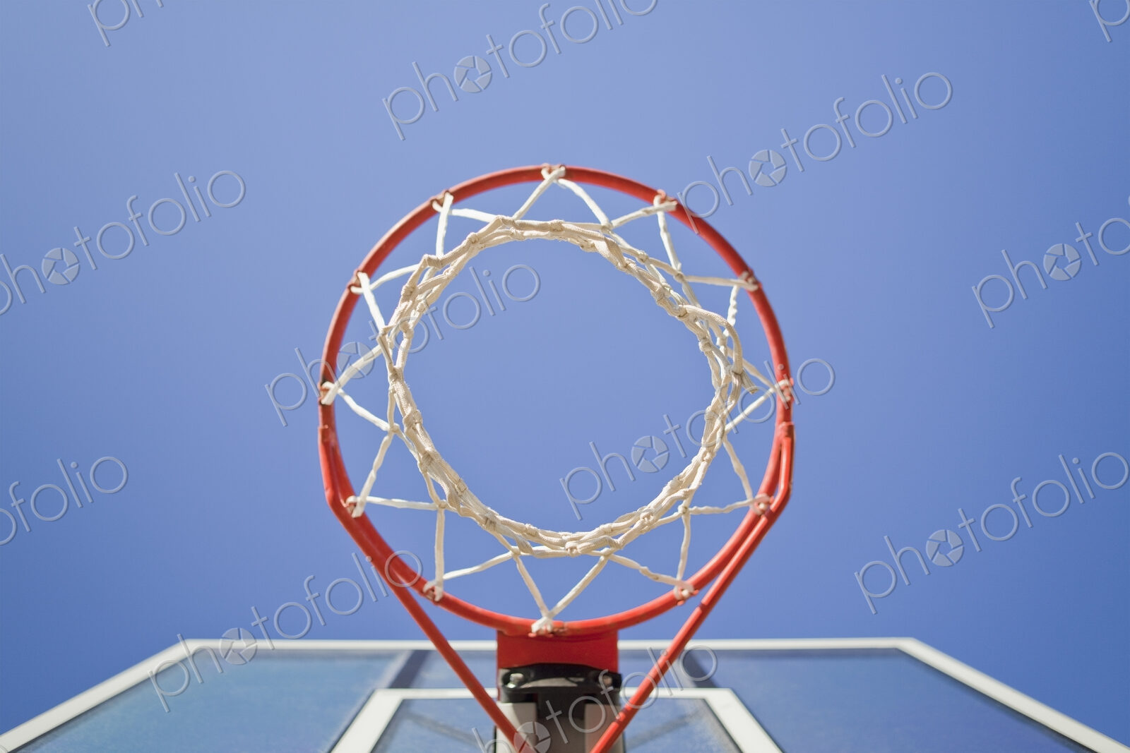 Basketball hoop, metal ring and netting, view from underneath.
