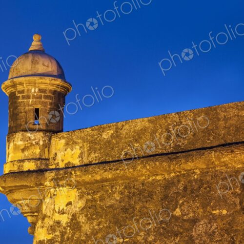 Bathed in warm light against the vivid blue twilight sky, this historic garita-or… Bathed in warm light against the vivid blue twilight sky, this historic garita-or…