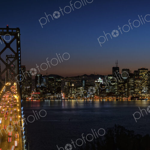 Bay Bridge at night, seen from above, traffic lit up, and the lights of the… Bay Bridge at night, seen from above, traffic lit up, and the lights of the…