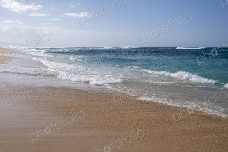 Beach and surf along Oahu's wild North Shore, Waimea Bay Beach.
