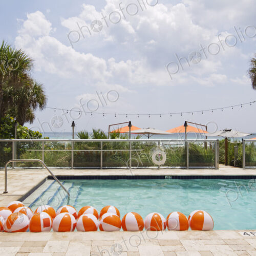 Beach balls in swimming pool