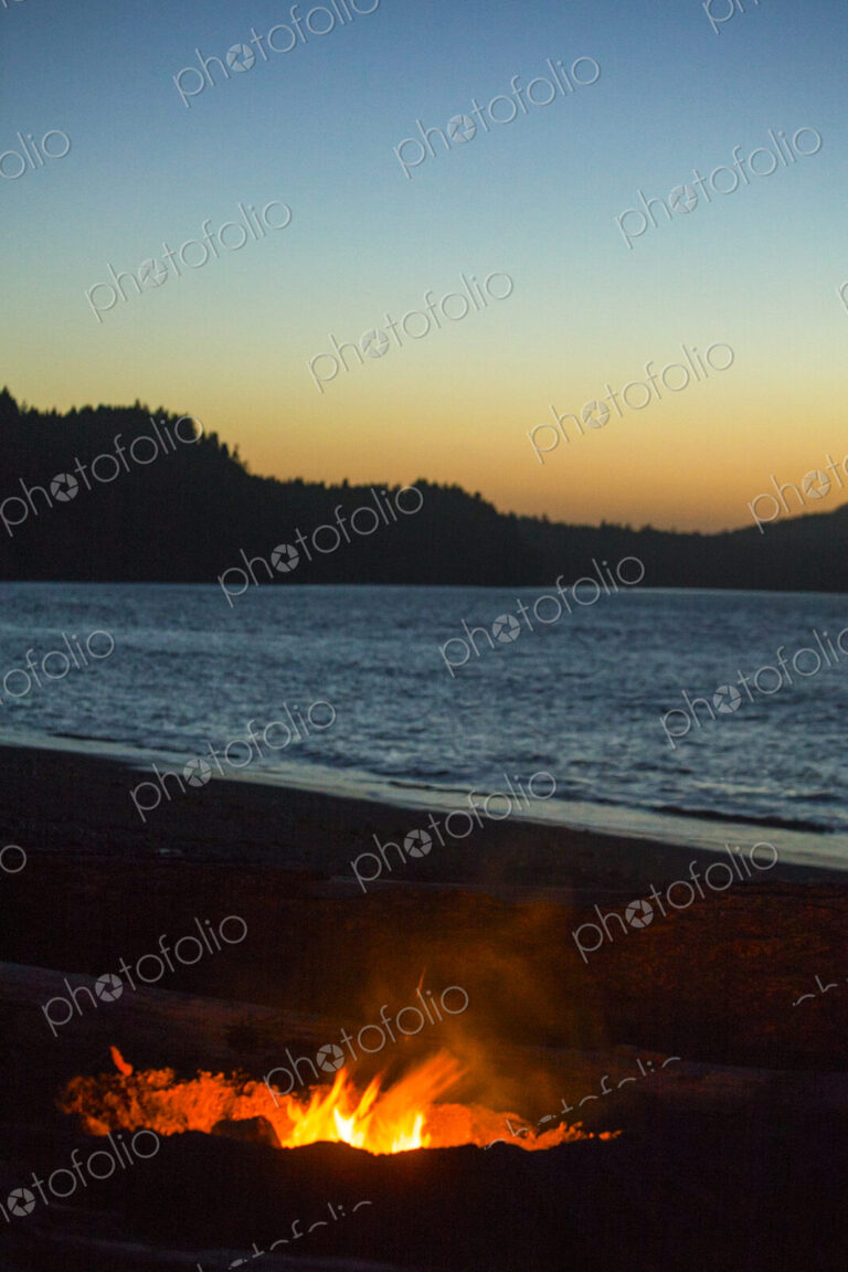Beach fire on Puget Sound, Port Angeles, flames at dusk.