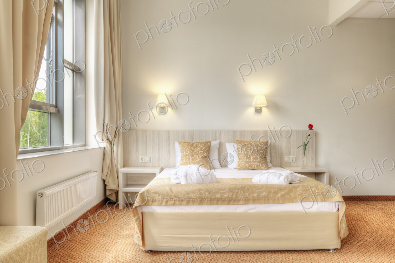 Bed and curtains in hotel room
