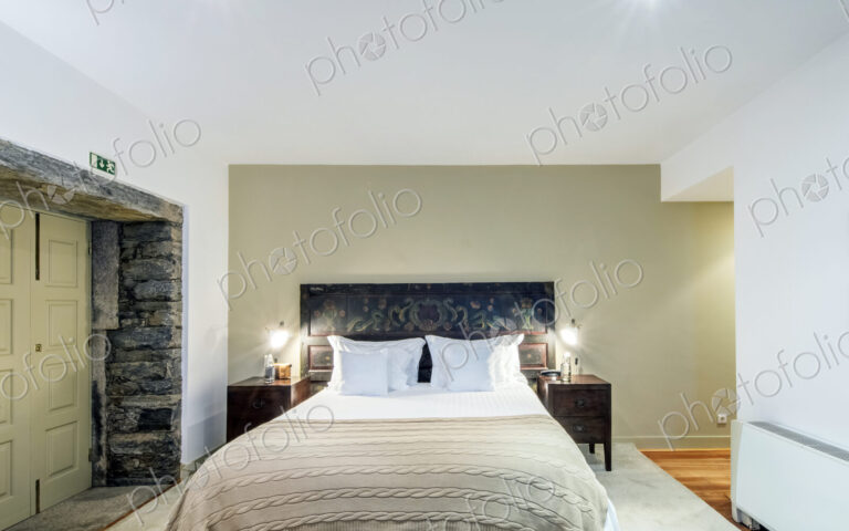 Bed and night tables in hotel room