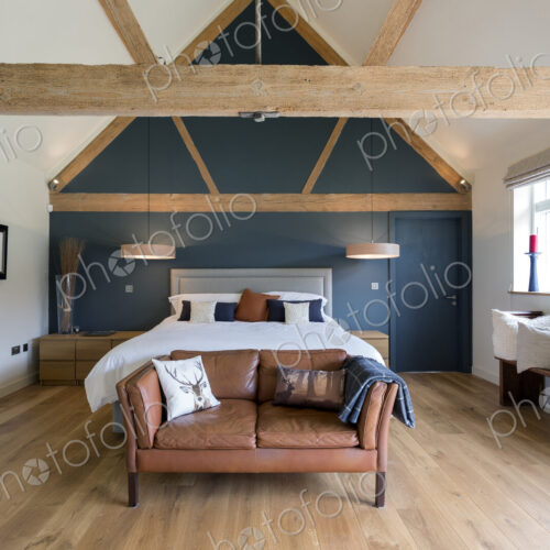 Bed and sofa in modern bedroom