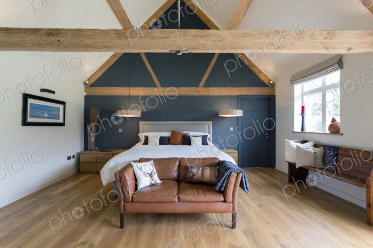 Bed and sofa in modern bedroom