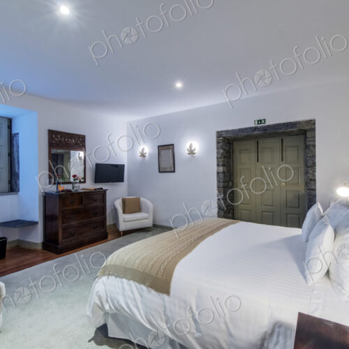 Bed and vanity in hotel room