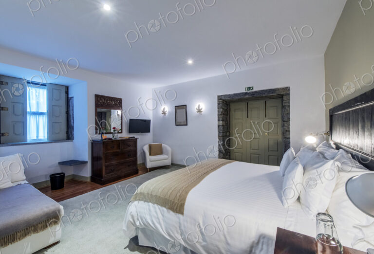 Bed and vanity in hotel room