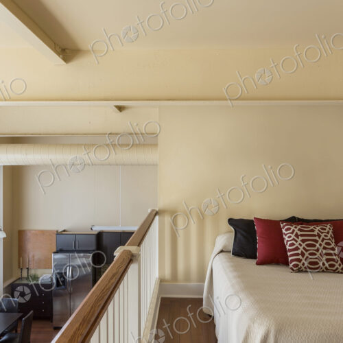 Bed in loft of modern home Bed in loft of modern home