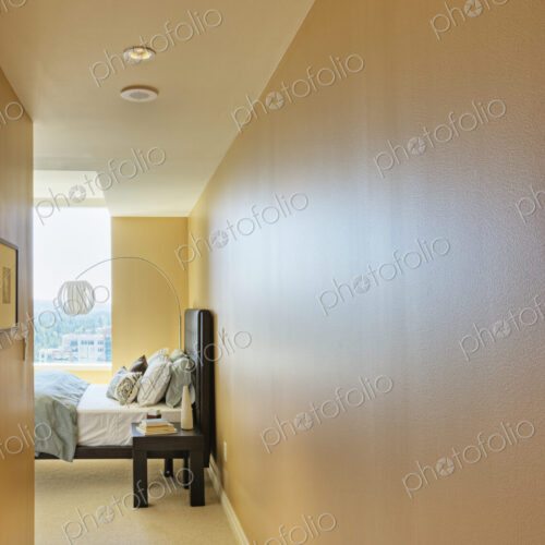 Bedroom with yellow walls and bed.