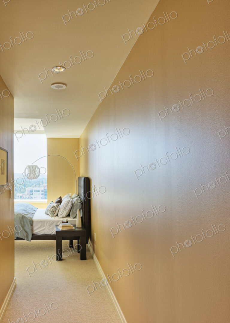 Bedroom with yellow walls and bed.