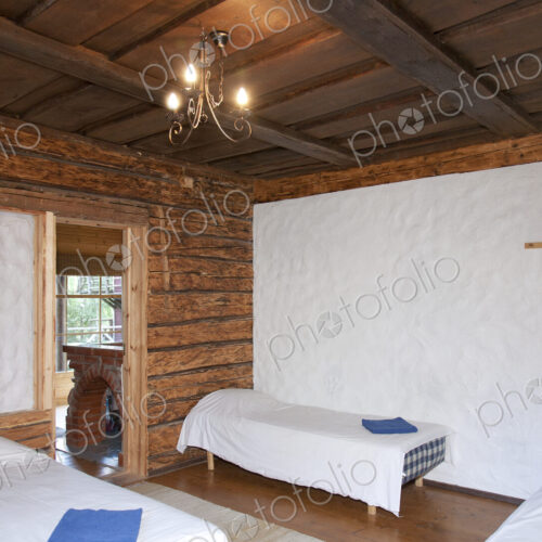 Beds in a Wooden Bedroom