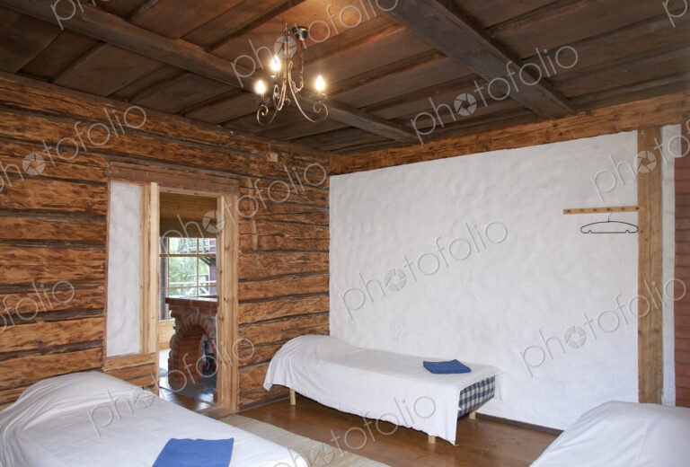 Beds in a Wooden Bedroom
