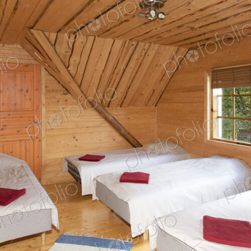 Beds in a Wooden Bedroom