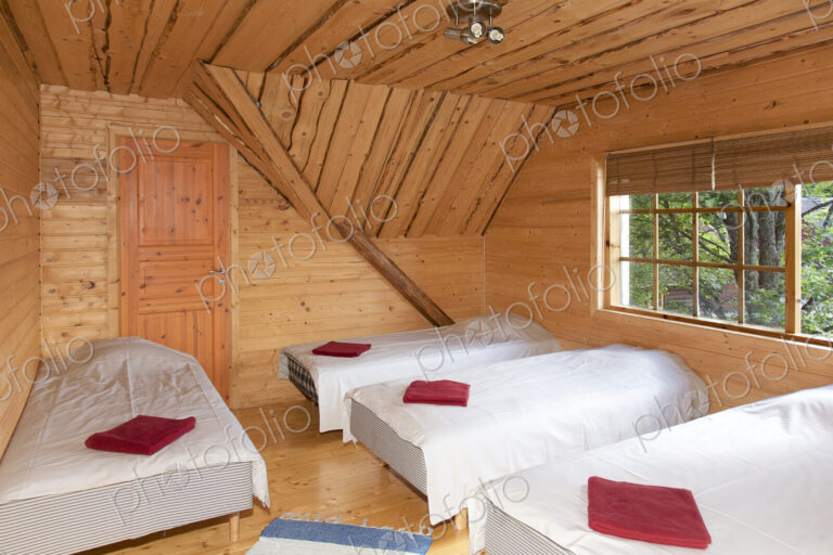Beds in a Wooden Bedroom