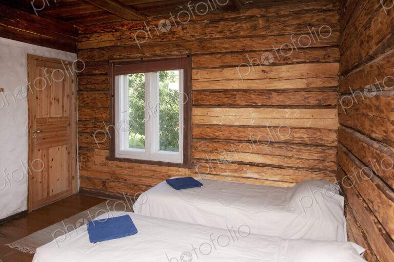 Beds in a Wooden Bedroom