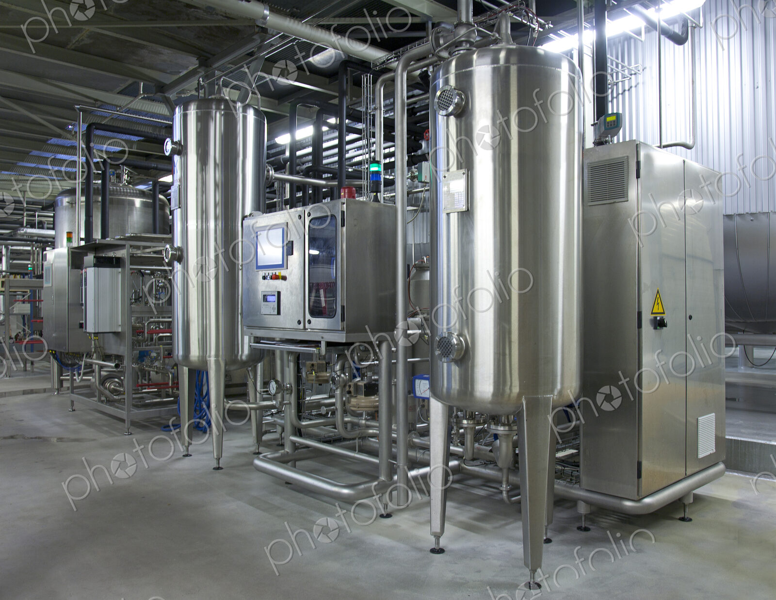 Beer brewing production plant. Large storage and fermenting tanks, stainless steel…