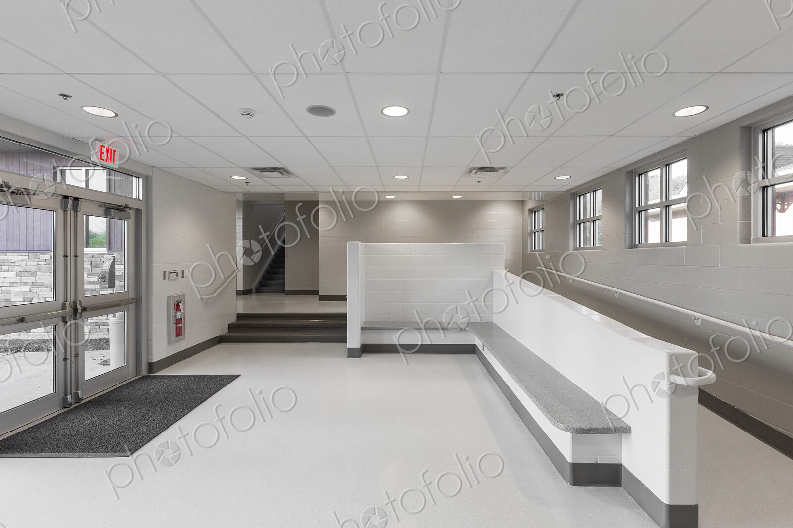 Benches, ramp and stairs in lobby of animal shelter