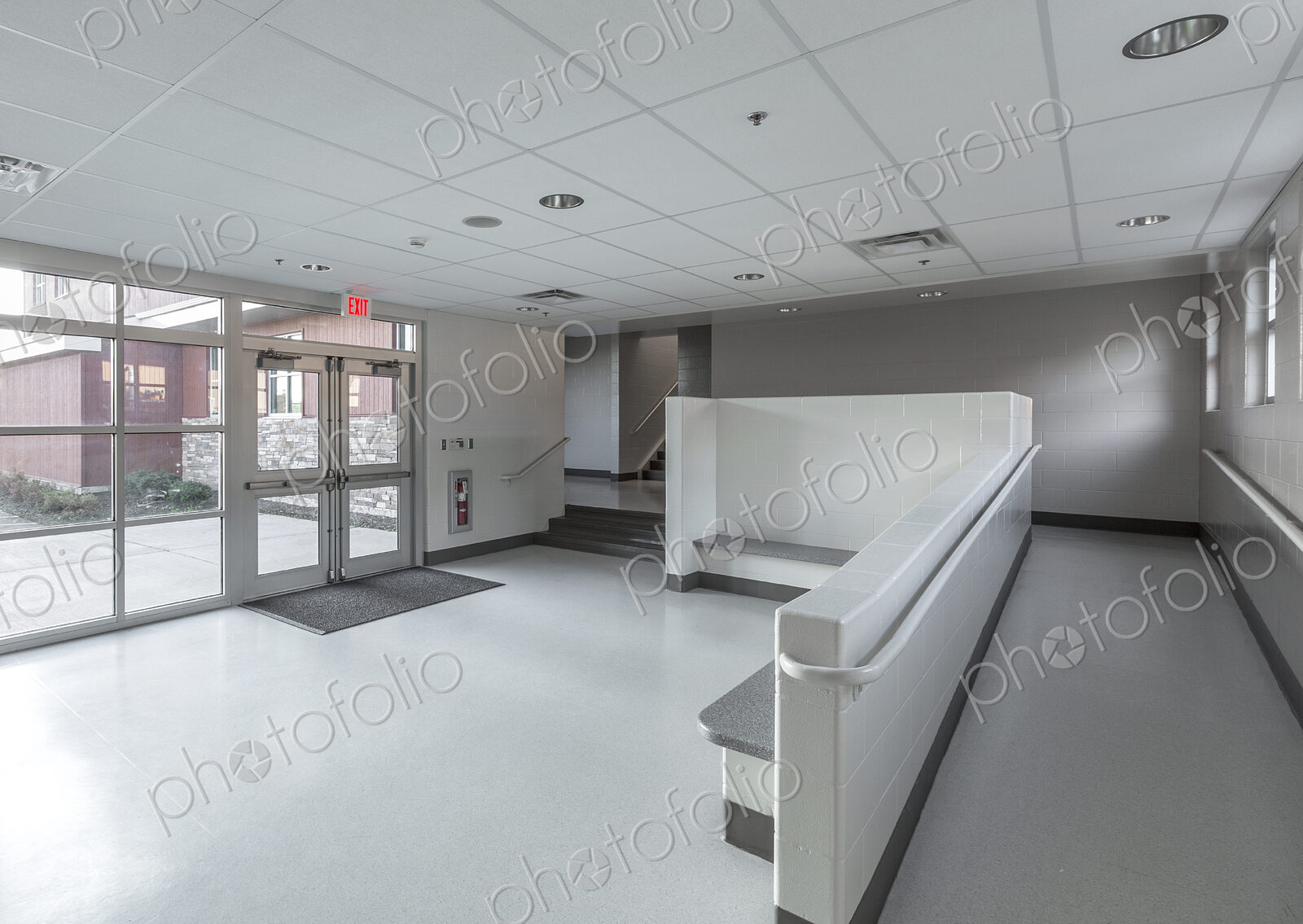 Benches, ramp and stairs in lobby of animal shelter