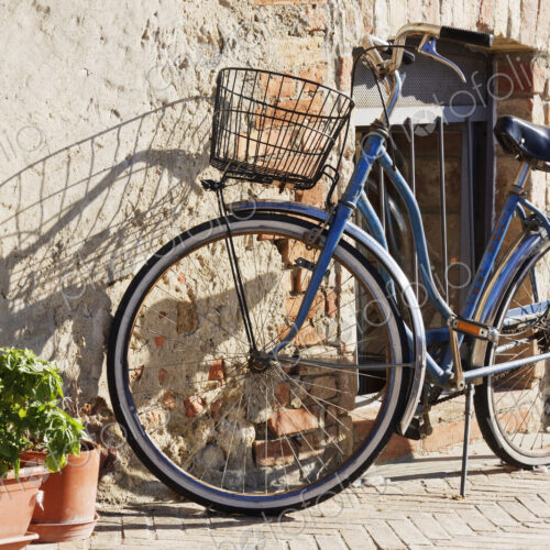 Bicycle leaning on stone house wall. Bicycle leaning on stone house wall.