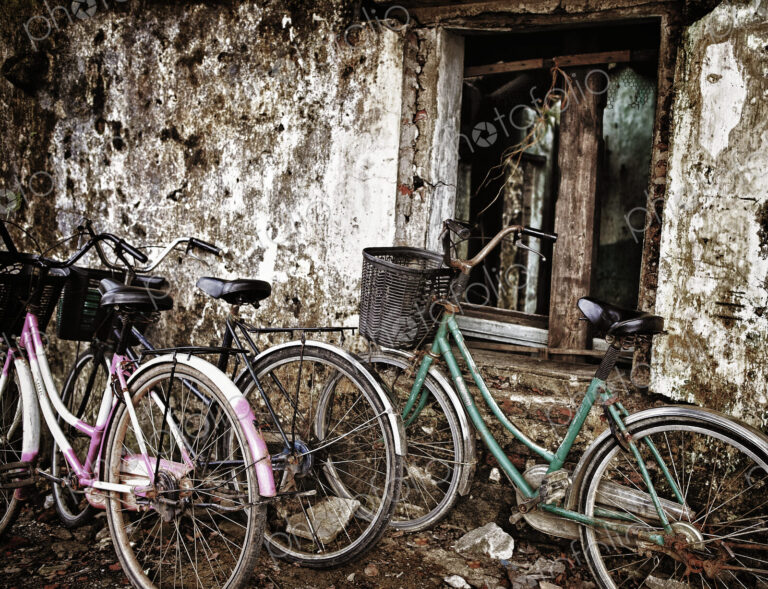 Bicycles Parked Along an Old Wall