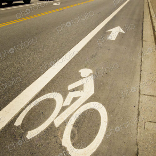 Bicycling path sign on a road surface, a dedicated cycle lane.