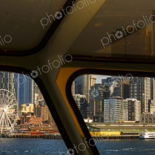 Big Wheel and Downtown Seattle views from a Puget Sound ferry window, Seattle, WA USA Big Wheel and Downtown Seattle views from a Puget Sound ferry window, Seattle, WA USA