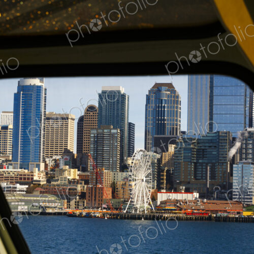 Big Wheel and Downtown Seattle views from a Puget Sound ferry window, Seattle, WA USA Big Wheel and Downtown Seattle views from a Puget Sound ferry window, Seattle, WA USA