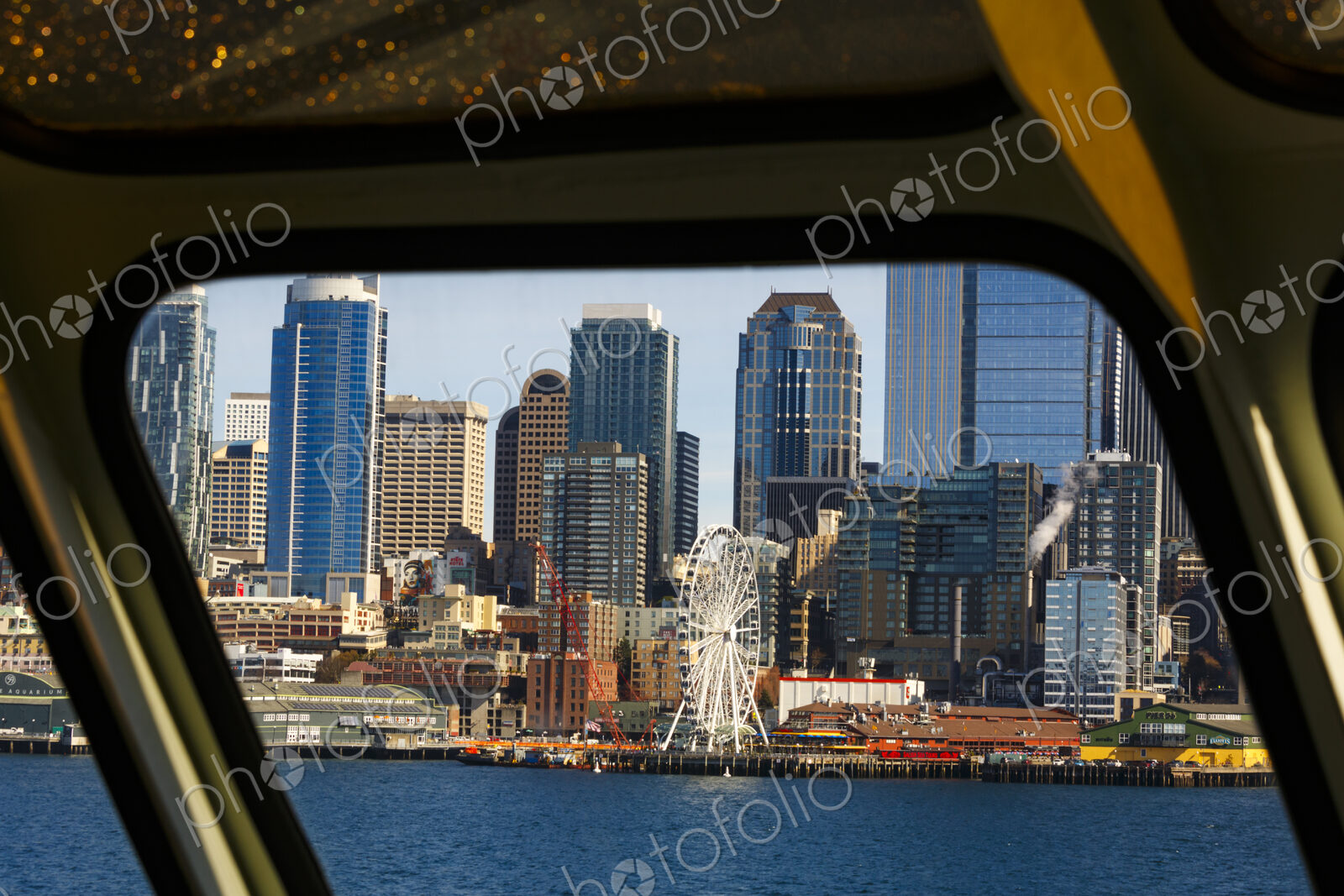 Big Wheel and Downtown Seattle views from a Puget Sound ferry window, Seattle, WA USA