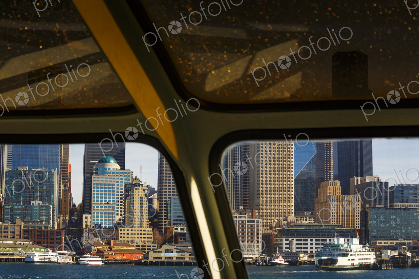 Big Wheel and Downtown Seattle views from a Puget Sound ferry window, Seattle, WA USA