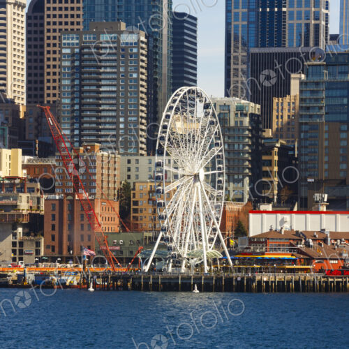 Big Wheel and Downtown Seattle views from the harbour. Big Wheel and Downtown Seattle views from the harbour.