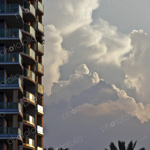 Billowing Clouds Behind a Tall Hotel Billowing Clouds Behind a Tall Hotel