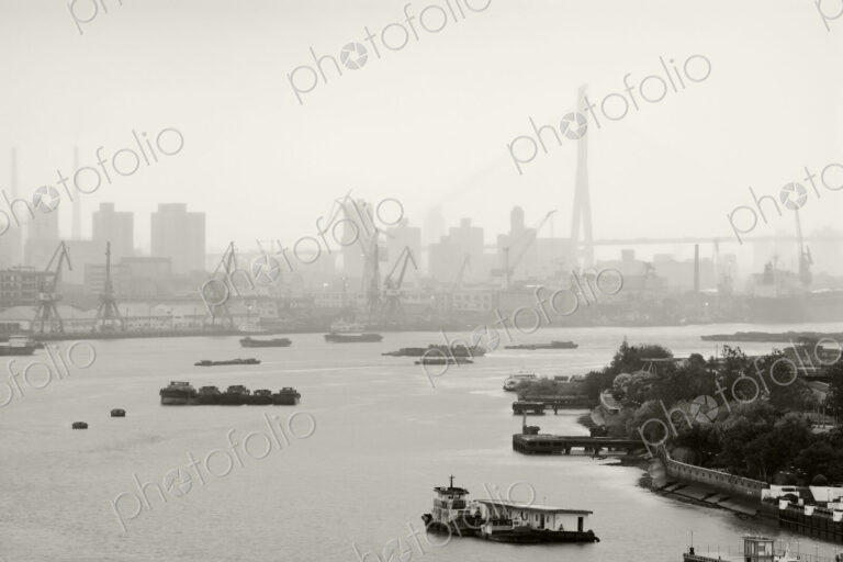 Black and White of Cranes and River Traffic