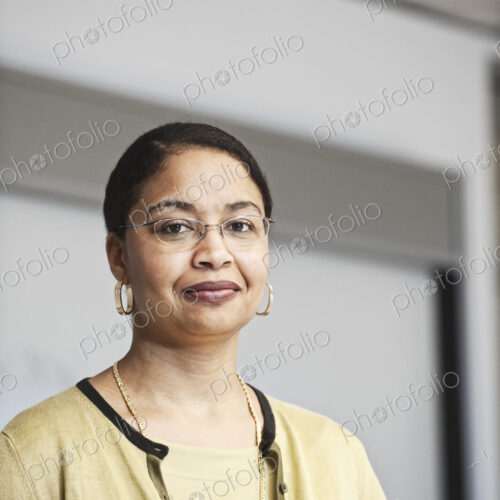 Black businesswoman in a conference room setting. Black businesswoman in a conference room setting.