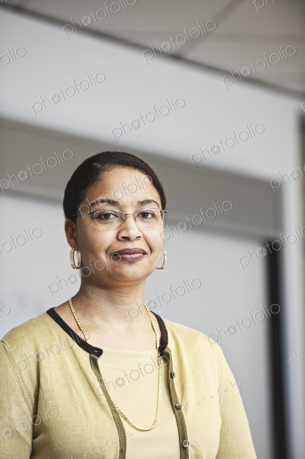 Black businesswoman in a conference room setting.