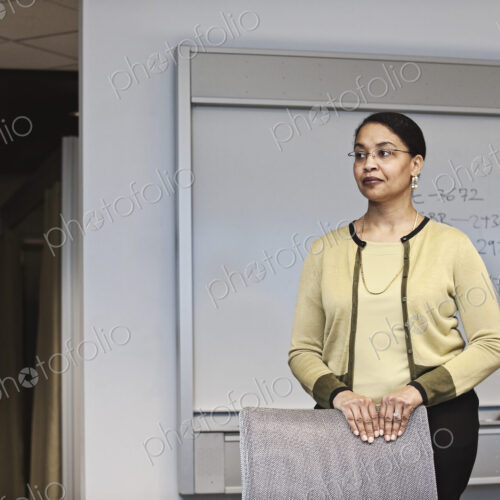 Black businesswoman in a conference room setting. Black businesswoman in a conference room setting.