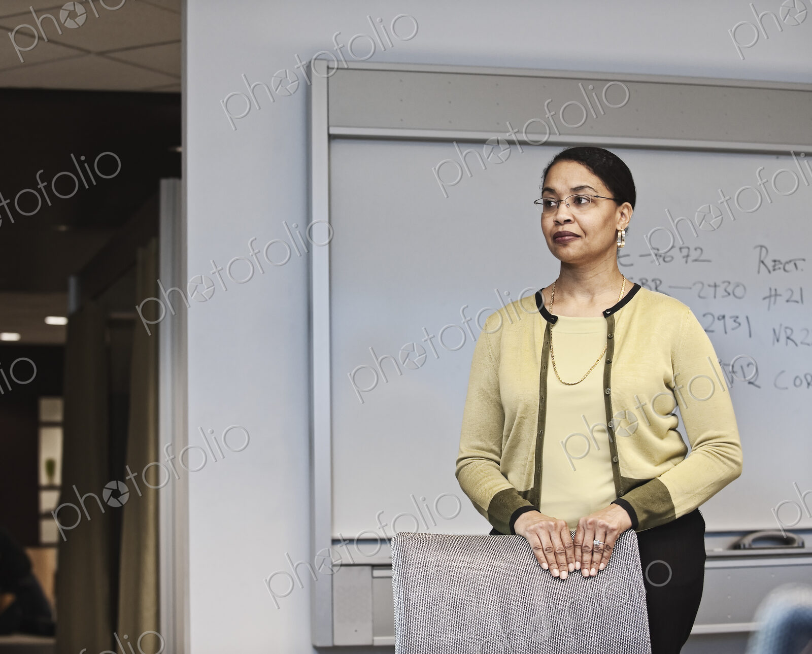 Black businesswoman in a conference room setting.