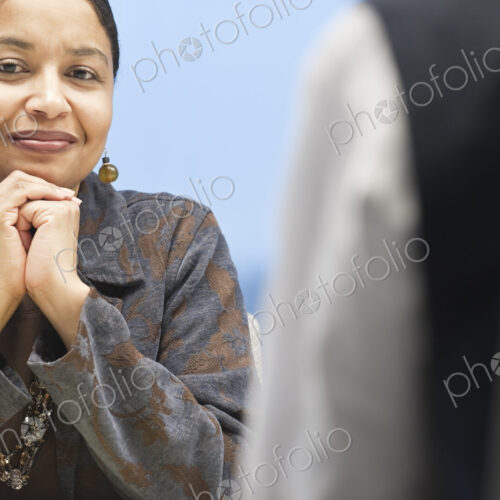 Black businesswoman in a conference room setting. Black businesswoman in a conference room setting.