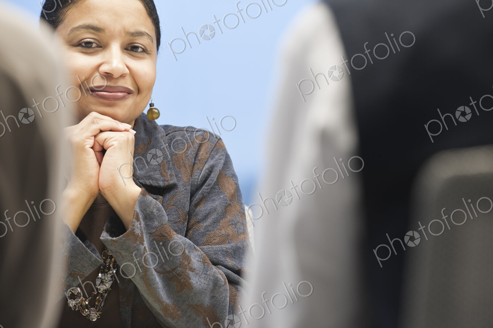 Black businesswoman in a conference room setting.