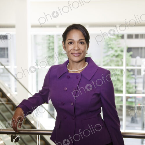 Black businesswoman in lobby of large business center Black businesswoman in lobby of large business center