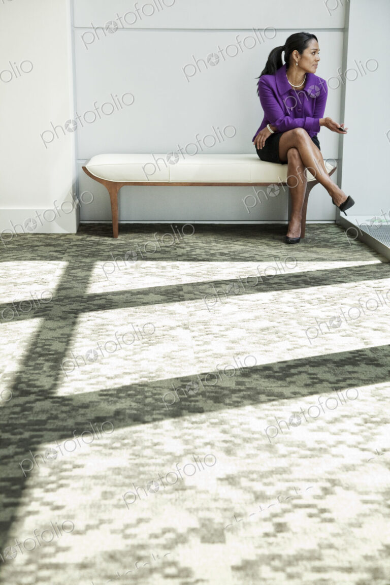 Black businesswoman in lobby of large business center