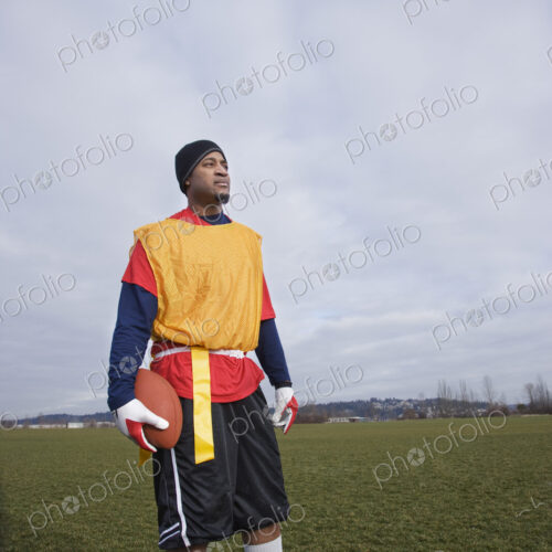 Black man, a member of an Americn flag football team.